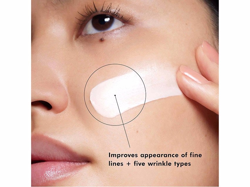 Women applying SkinCeuticals A.G.E. Interrupter Advanced Corrective Cream